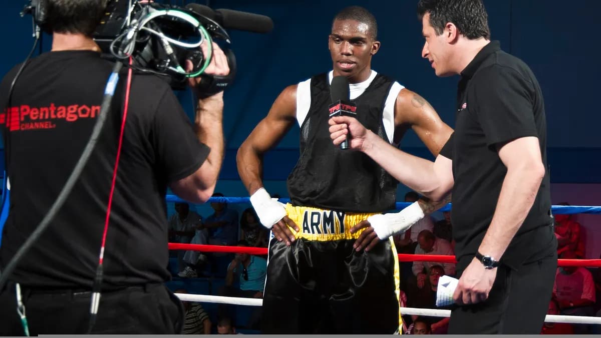 A boxer stepping on the scale at an official weigh-in ahead of fight night